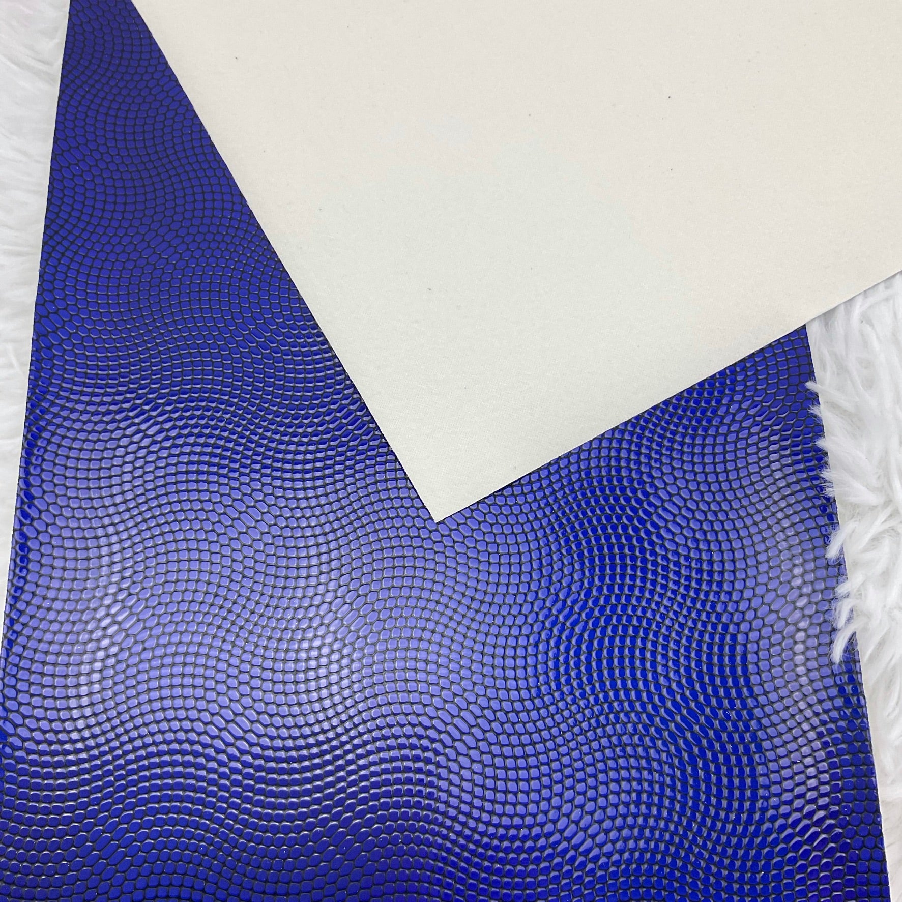 Blue and Black Embossed Pebbles Glossy Faux Leather