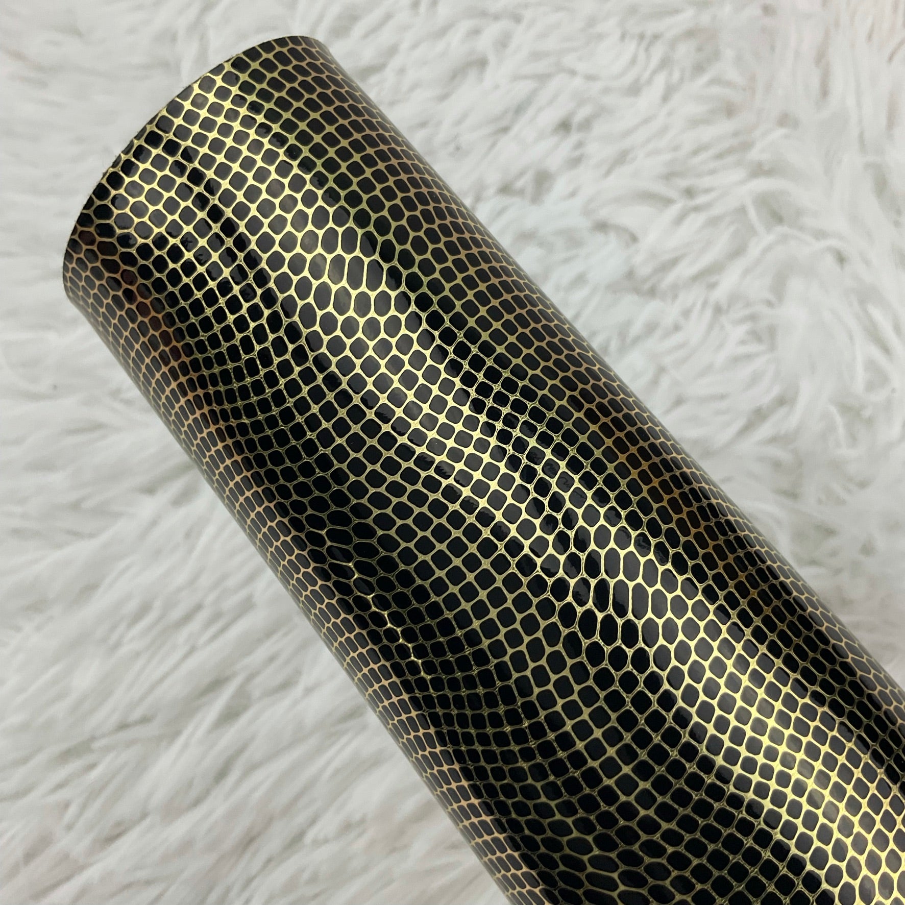 Gold and Black Embossed Pebbles Glossy Faux Leather